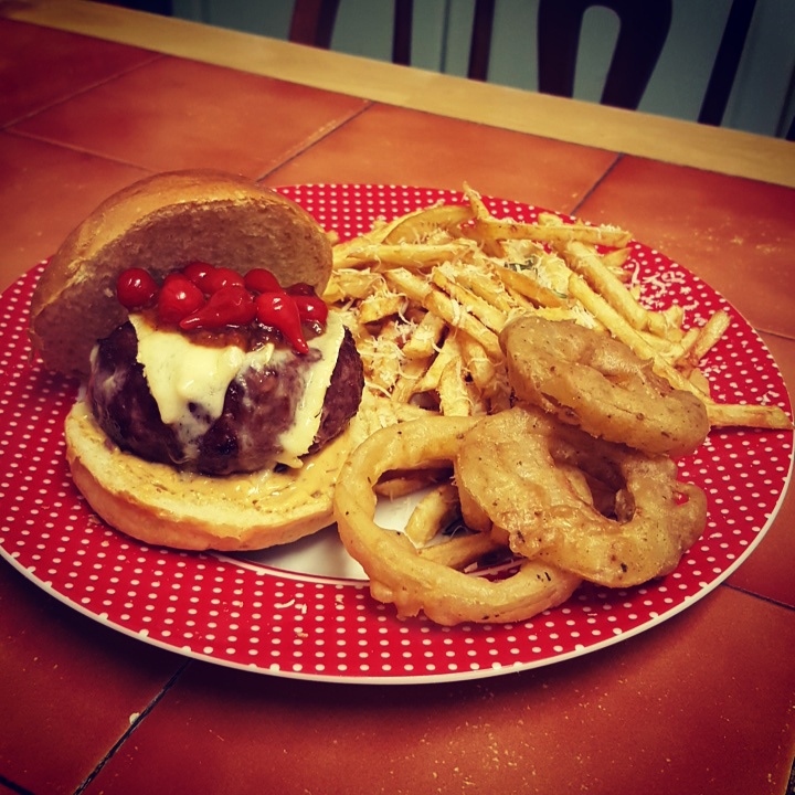 cheese burger, fresh french fries and homemade onion rings