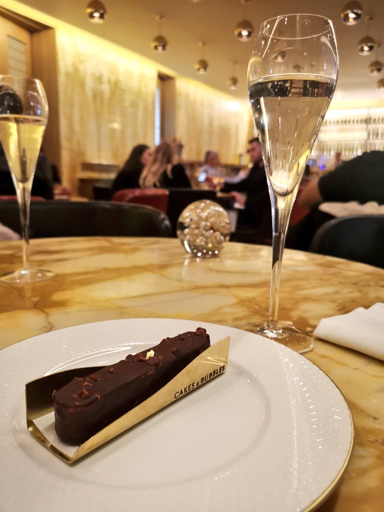 Chocolate and praline eclair at Cakes and Bubbles - Hotel Cafe Royal Review London