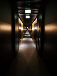 Dark and golden corridor at Nobu Hotel Shoreditch